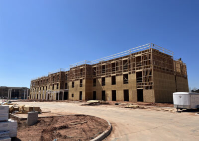 Three-story multi-family apartment building under construction in Abilene, Texas with wood framing exposed